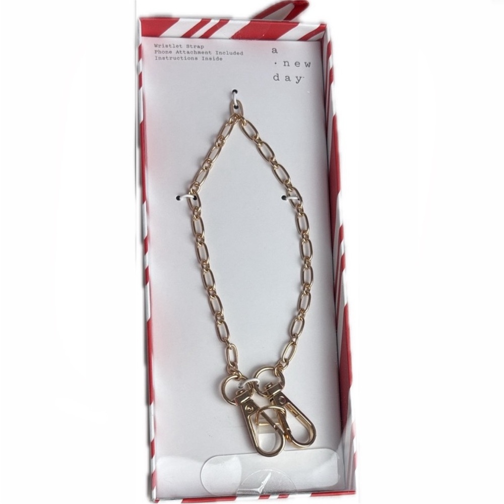 A New Day Gold Link wristlet strap phone attachment includes instructions